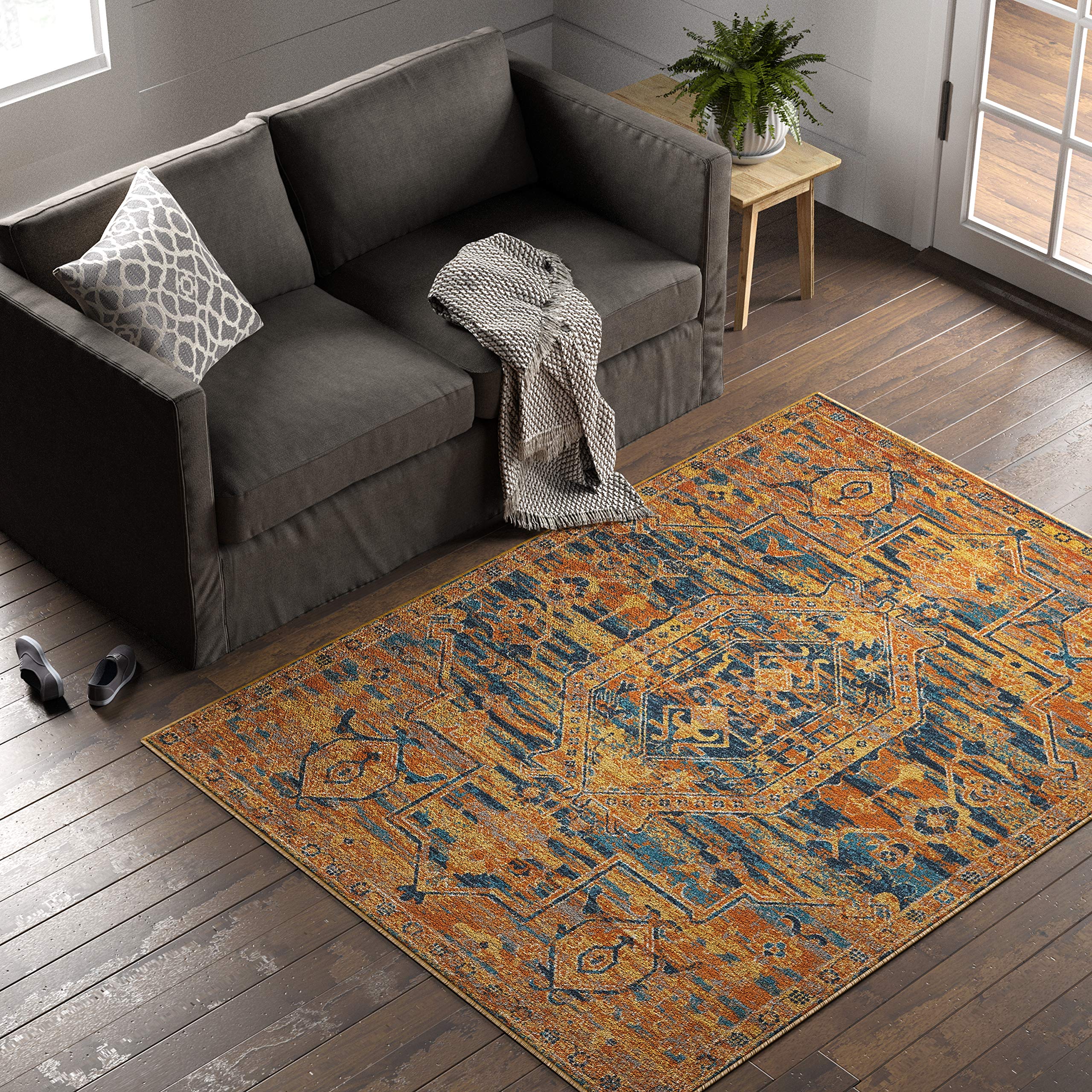 Amazon Brand – Stone & Beam Old World Area Rug, 5' 3" x 7' 3", Blue and Orange
